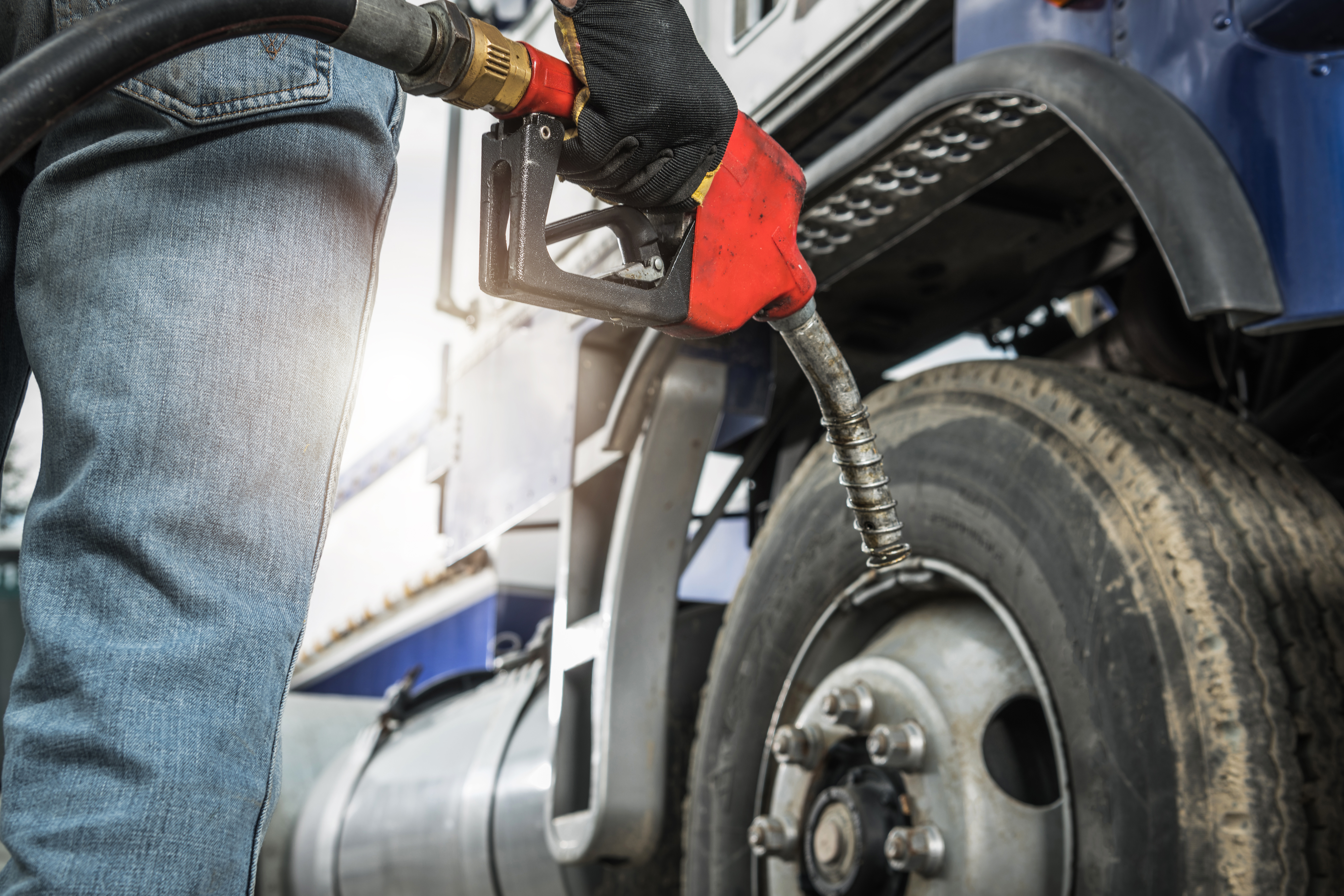 Semi Truck Driver About to Refuel His Tractor Truck with Diesel DIESEL FUEL DELIVERY